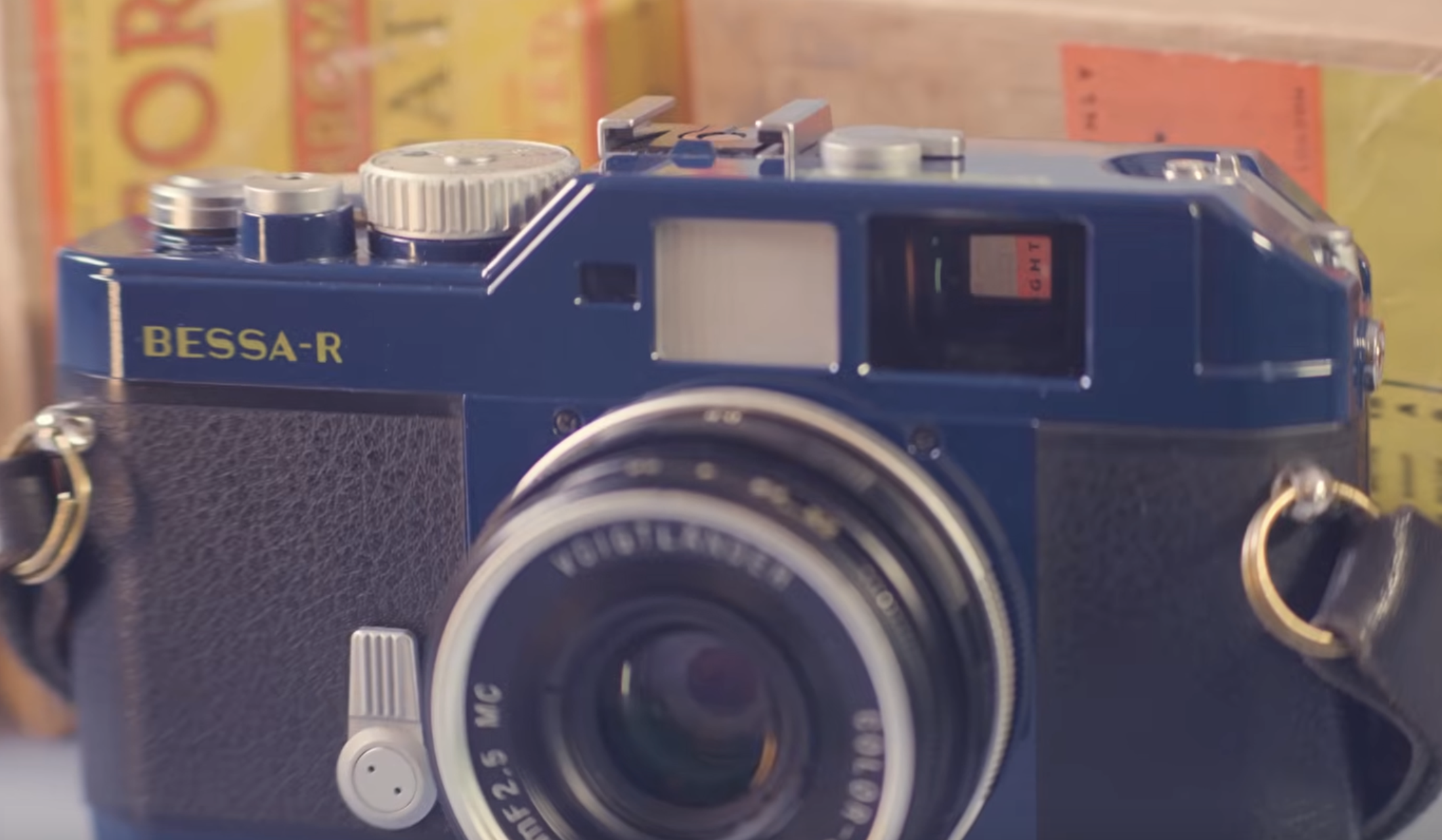 A dark blue Voigtlander Bessa-R rangefinder camera with a lens attached.
